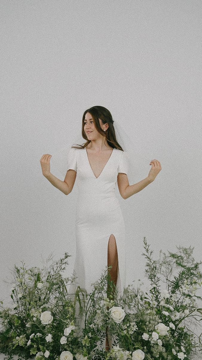 Yvette Plunging V-neck Short Cap Sleeves Column Wedding Dress | Low V back with Nude Mesh Column Sheath Skirt | Bone and Grey Bridal | Minimal wedding dresses online Canada Singapore USA