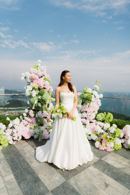 Zoe Duchess Satin Basque Waist A-Line Bubble Hem Wedding Dress with Cape | Bone and Grey Bridal | Affordable Minimal Simple Bridal Gowns Online Canada USA Singapore