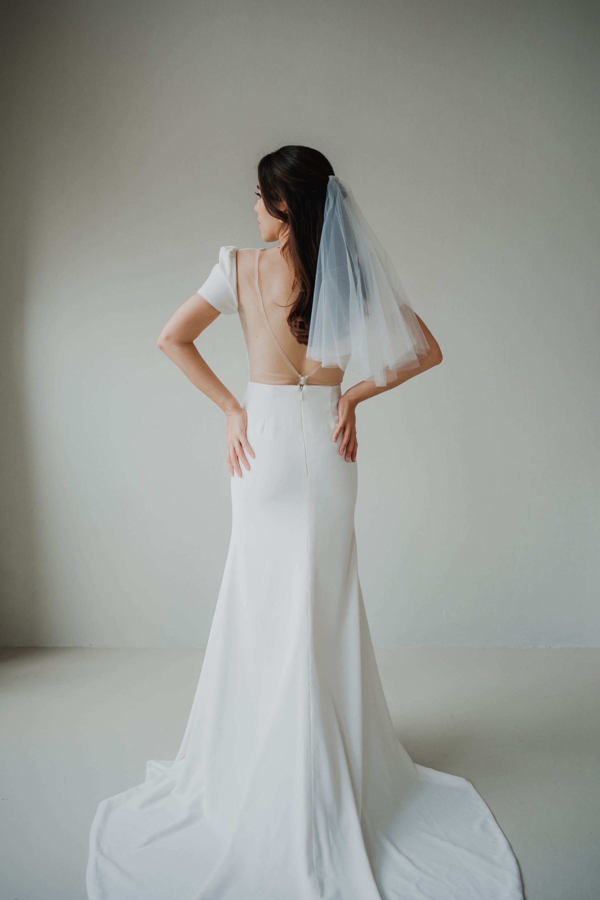 Yvette Plunging V-neck Short Cap Sleeves Minimal Wedding Dress | Low V back with Nude Mesh Column Sheath Skirt | Bone & Grey Bridal Bone and Grey Bridal Yvette Plunging V-neck Short Cap Sleeves Minimal Wedding Dress | Low V back with Nude Mesh Column Sheath Skirt | Bone & Grey Bridal Bone and Grey Bridal