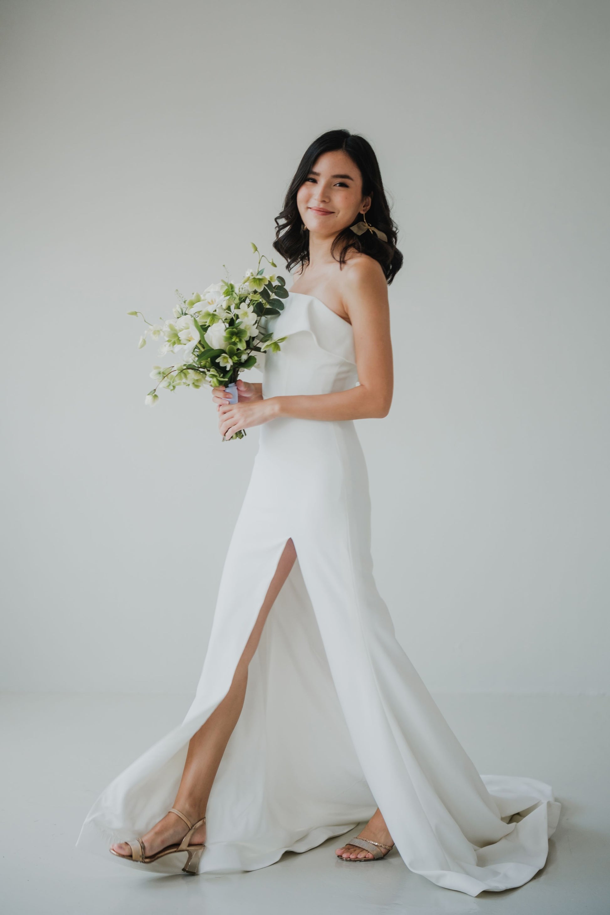 Olivia Frilly Straight Strapless Crepe Column Minimal Wedding Dress with Slit | Bone and Grey Bridal | Affordable Simple Bridal Gowns Online Canada USA Singapore Olivia Frilly Straight Strapless Crepe Column Minimal Wedding Dress with Slit | Bone and Grey Bridal | Affordable Simple Bridal Gowns Online Canada USA Singapore